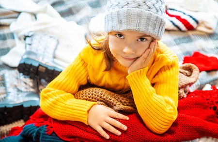 the child is dressed in winter clothes. selective focus. winter.の写真素材