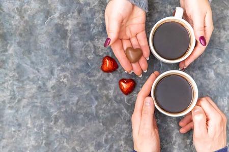 Lovers drink coffee with sweets. Selective focus. Drinkの写真素材