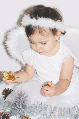 little child in the costume of an angel. Selective focus.の写真素材