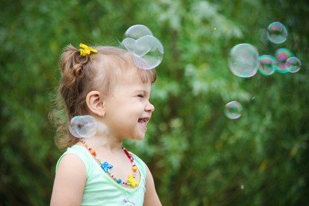 Child let the soap bubbles. Selective focus.の写真素材