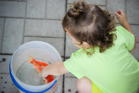 baby and red fish. Selective focus. nature.の写真素材
