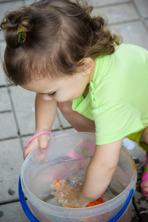 baby and red fish. Selective focus. nature.の写真素材