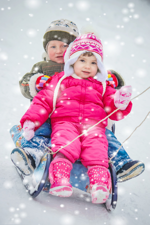 A child plays in the snow in the winter. Selective focus.の写真素材
