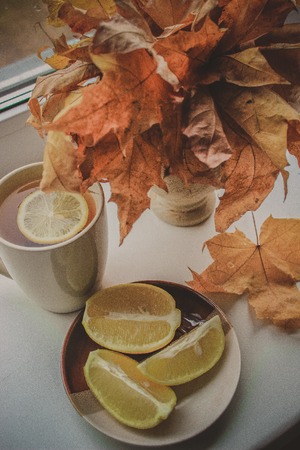Autumn leaves and a book. Selective focus.の写真素材