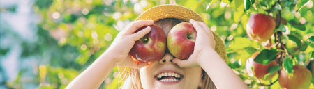 Child with Child with an apple. Selective focus. Garden Food