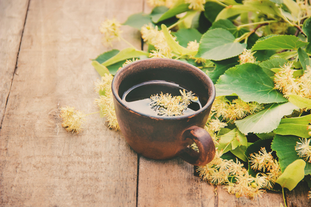 linden tea and flowers. Selective focus. drink cupの写真素材