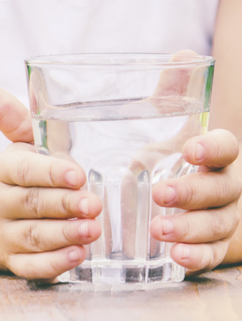 child glass of water. selective focus. food and drink. nature