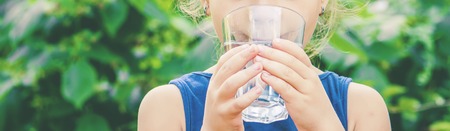 child glass of water. selective focus. Childrenの写真素材