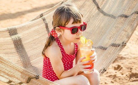 girl child resting on the sea. Selective focus. nature. natureの写真素材