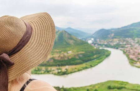 Woman traveler on the background of the attractions of Georgia. Near the monastery Jvari. Selective focus. nature.の写真素材