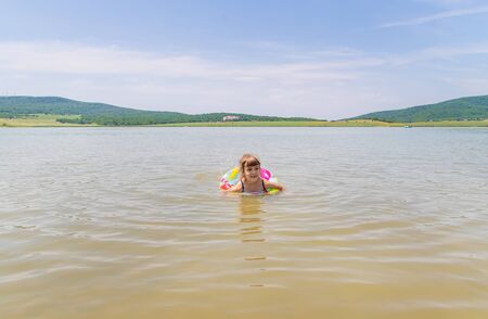 children swimming in the lake. Selective focus.