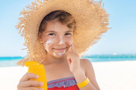 Sunscreen on the skin of a child. Selective focus.