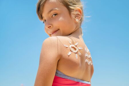 Sunscreen on the skin of a child. Selective focus.