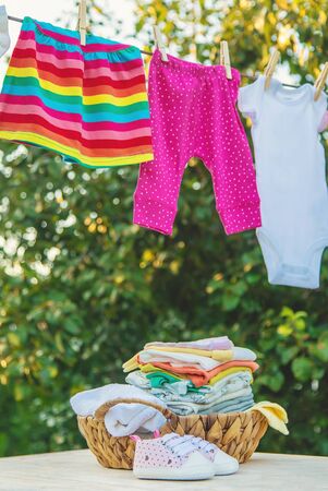 washing baby clothes. Linen dries in the fresh air. Selective focus. nature.の写真素材