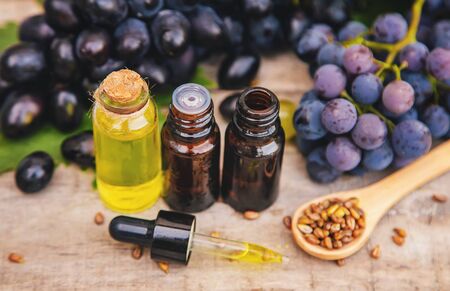 Grape seed oil in a small bottle. Selective focus. nature.の写真素材