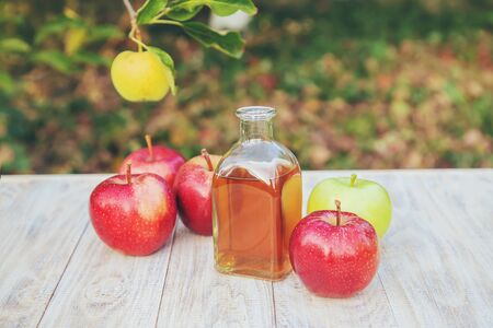 Apple cider vinegar in a bottle. Selective focus. nature.の写真素材