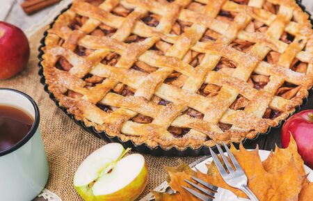 Pie with apples and cinnamon. Selective focus. Food.の写真素材