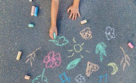 Children's drawings on the asphalt with chalk. Selective focus. nature.の写真素材