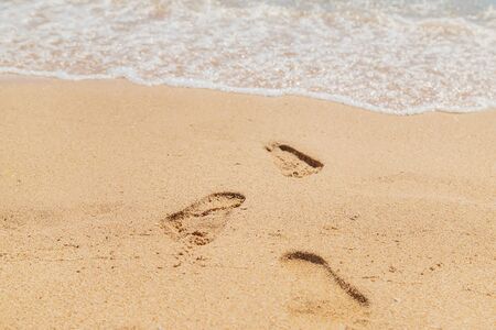 footprints in the sand along the sea. Selective focus. nature.