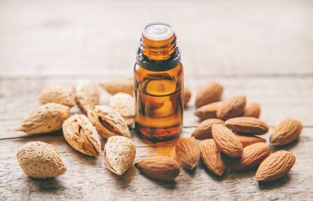 Almond essential oil in a small bottle. Selective focus. nature.の写真素材