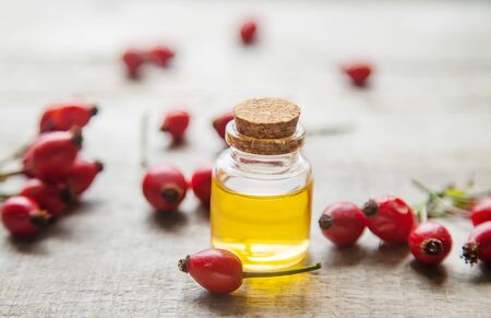 Rosehip seed essential oil in a small bottle. Selective focus. nature.の写真素材