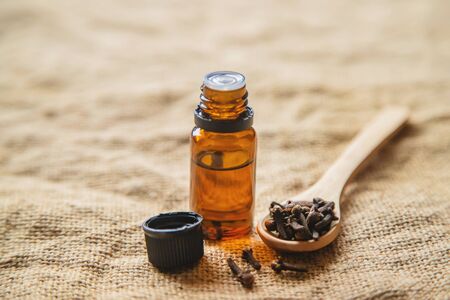 Clove essential oil in a small bottle. Selective focus. nature.の写真素材