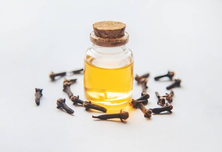 Clove essential oil in a small bottle. Selective focus. nature.の写真素材