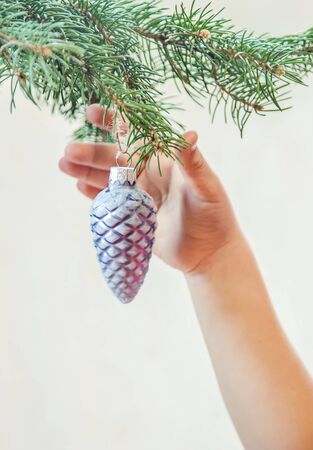 Christmas decorations in the hands of a child. Selective focus. holiday.の写真素材