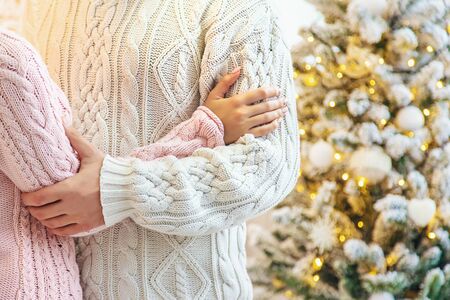 Lovers man and woman on a Christmas background. Holiday. Selective focus.の写真素材