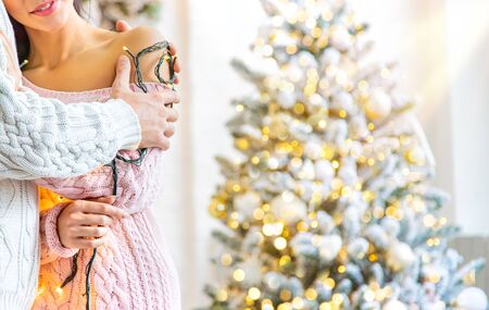 Lovers man and woman on a Christmas background. Holiday. Selective focus.の写真素材