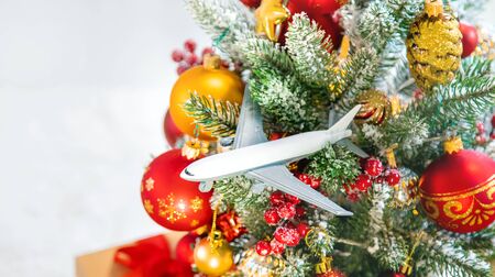 Christmas background with airplane. Travel concept for the holidays. Selective focus. New year.の写真素材