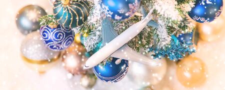 Beautiful christmas background with airplane. Travel concept for christmas and new year. Selective focus. Holiday.の写真素材