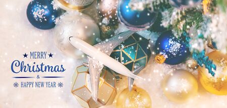Beautiful christmas background with airplane. Travel concept for christmas and new year. Selective focus. Holiday.の写真素材