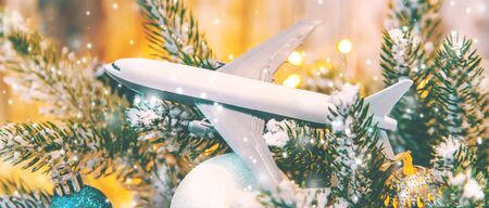 Beautiful christmas background with airplane. Travel concept for christmas and new year. Selective focus. Holiday.の写真素材
