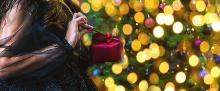 Girl with presents on Christmas night. Selective focus. Holiday.の写真素材