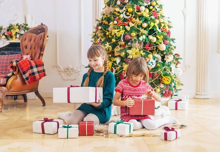 Children near the Christmas tree. Selective focus.の写真素材