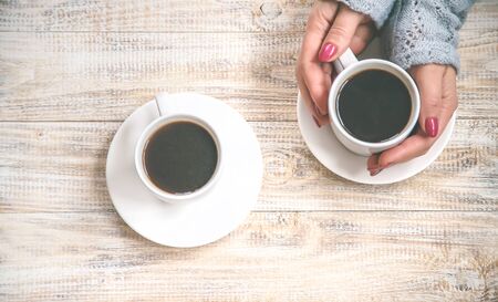 Cup drink for Breakfast in the hands of lovers. Selective focus. Food.の写真素材