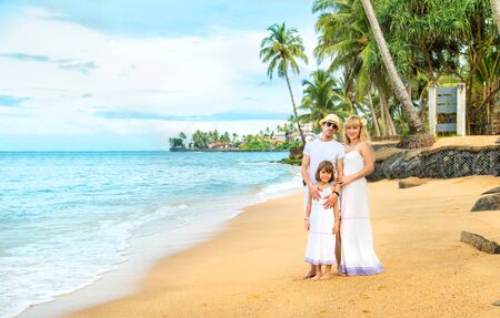 Family photo on an exotic beach. Selective focus.の写真素材