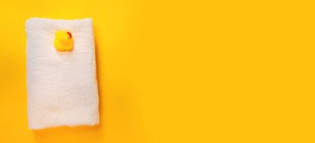 Accessories for bathing newborns on a yellow background. Selective focus. Baby.の写真素材