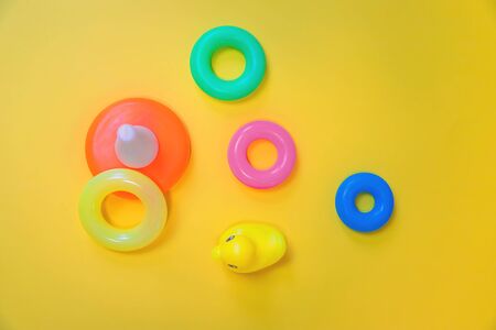 Accessories for newborns on a yellow background. Selective focus. Baby.