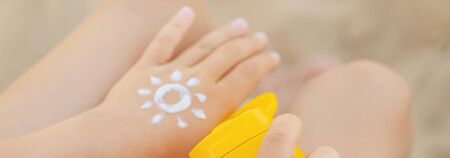Sunscreen on the skin of a child. Selective focus. nature.の写真素材