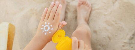 Sunscreen on the skin of a child. Selective focus. nature.の写真素材