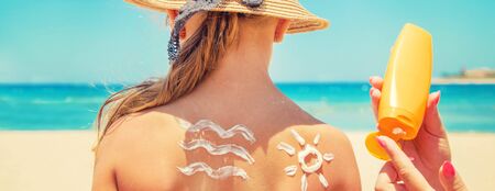 Sunscreen on the skin of a child. Selective focus. nature.