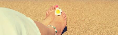 legs of a girl on the seashore. Selective focus. nature.