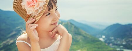 Child on the background of the sights of Georgia. Near the monastery Jvari. Selective focus.の写真素材