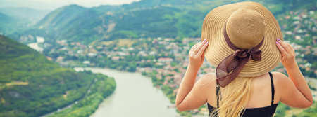 Woman traveler on the background of the attractions of Georgia. Near the monastery Jvari. Selective focus. nature.の写真素材