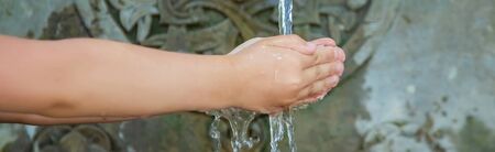 children drink water from a spring in Borjomi, Georgia. Selective focus. nature.