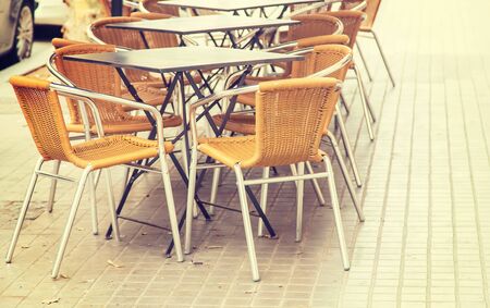 Street cafe tables and chairs. Selective focus. nature.の写真素材