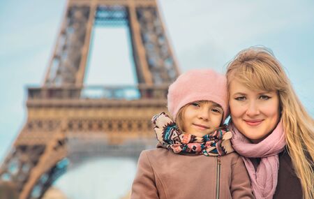 Family photo near the Eiffel Tower in Paris. Selective focus.の写真素材
