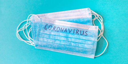 Coronavirus. Remedies. Masks on a blue background. Selective focus medicineの写真素材
